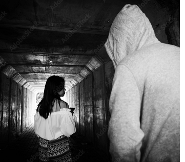 Man stalking woman